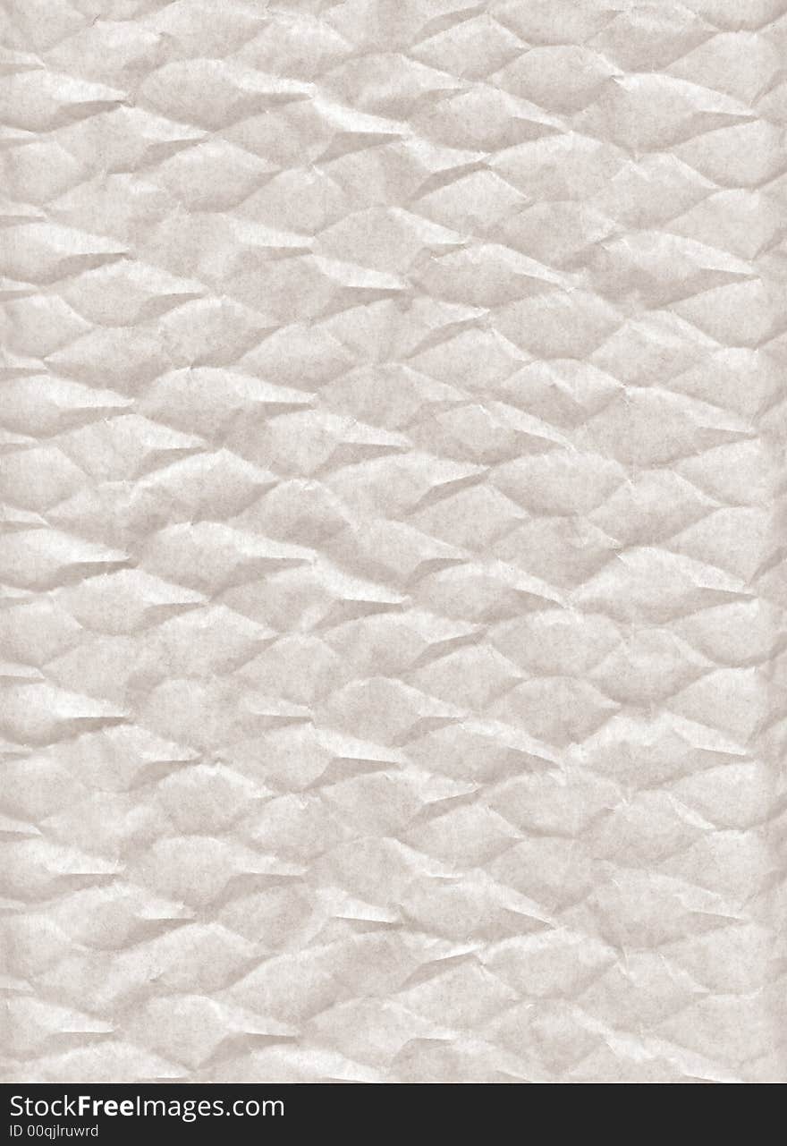 Crumpled paper. A porous paper. The thin structure fine chaotic fibers is visible