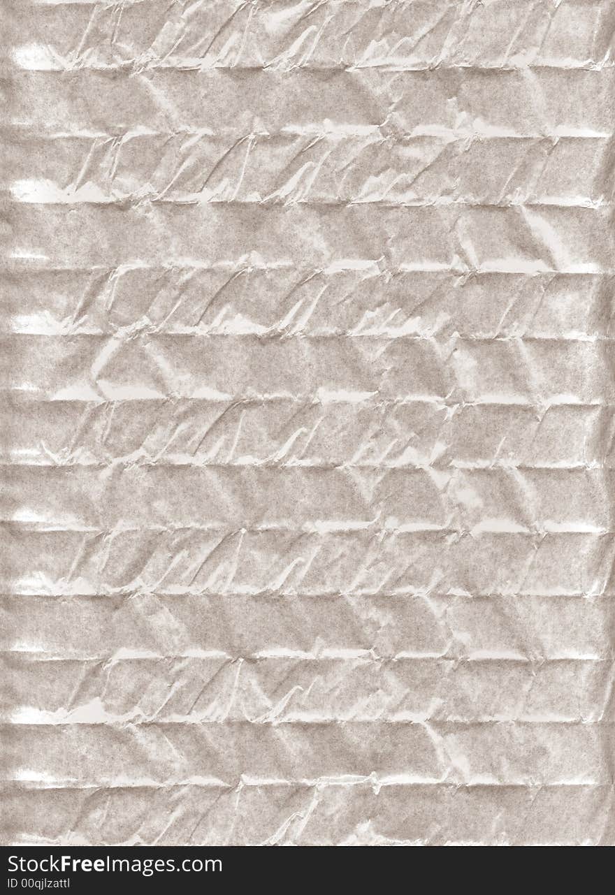 Crumpled paper. A porous paper. The thin structure fine chaotic fibers is visible