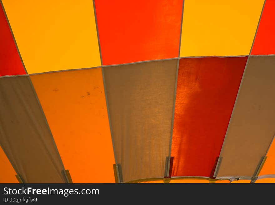 Close up shot of the canvas of a red and yellow hot air balloon. Close up shot of the canvas of a red and yellow hot air balloon