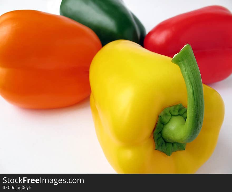 Four multiple colored peppers