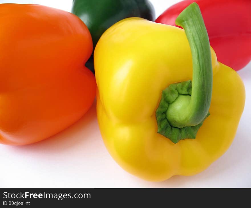 Four multiple colored peppers