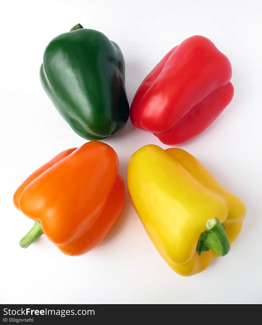 Four multiple colored peppers