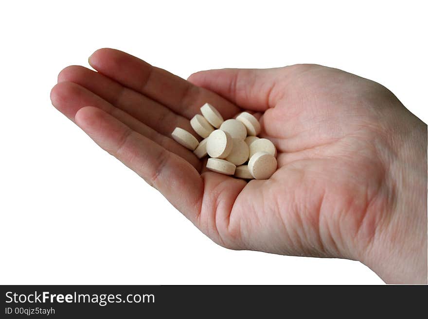 There are many pills in the person's hand signifying overmedication, prescription, dosing or even compliance. There are many pills in the person's hand signifying overmedication, prescription, dosing or even compliance.