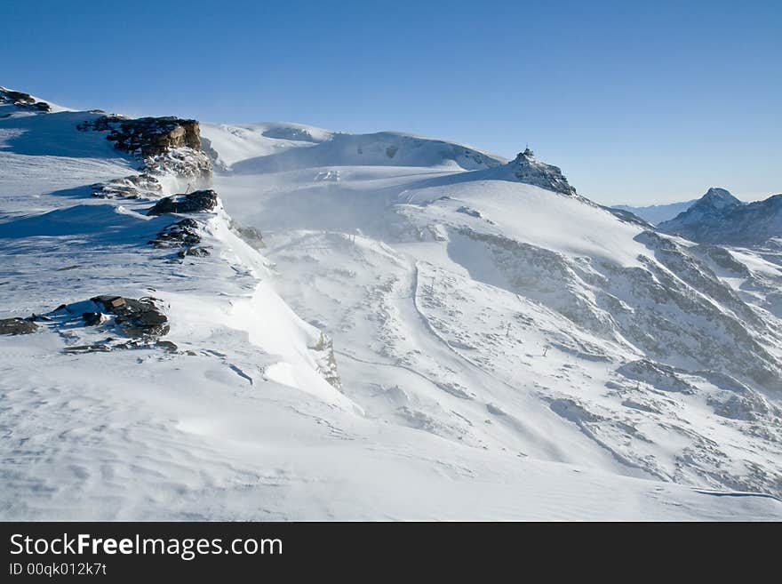 View from Klein Matterhorn glacier. Altitude about 3800m. Swiss Alps. Ski resourt close to Zermatt/Matterhorn. View from Klein Matterhorn glacier. Altitude about 3800m. Swiss Alps. Ski resourt close to Zermatt/Matterhorn.