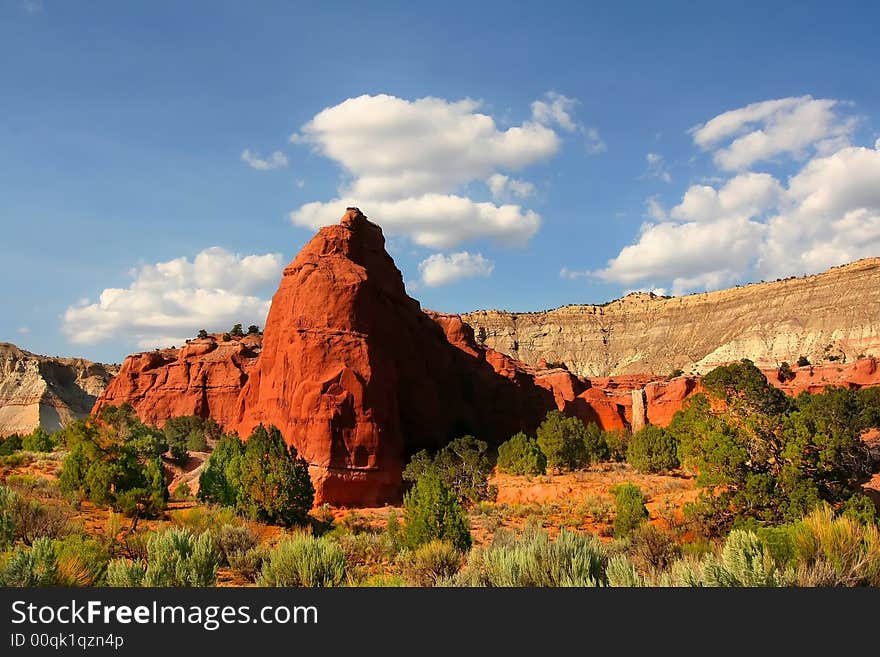 View of the red rock formations in Kodachrome Basin with blue skys and clouds