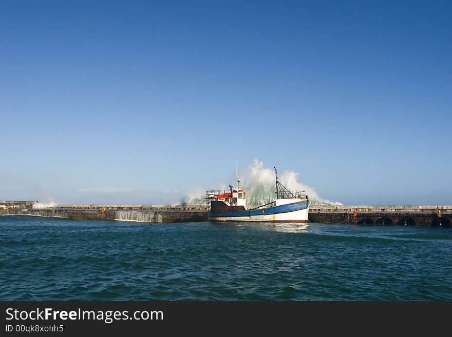 Waves on harbor wall