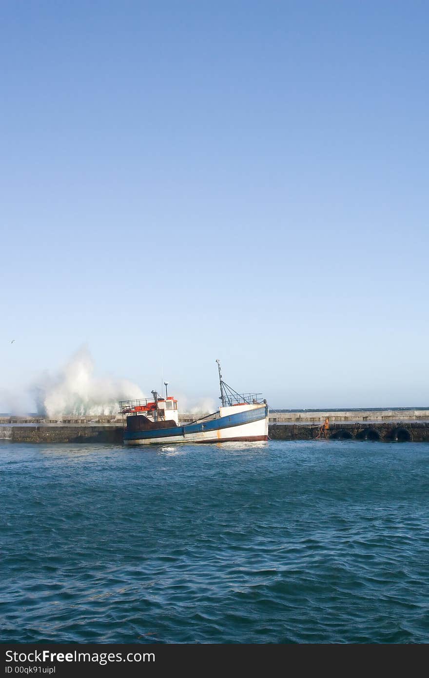 Waves on harbor wall