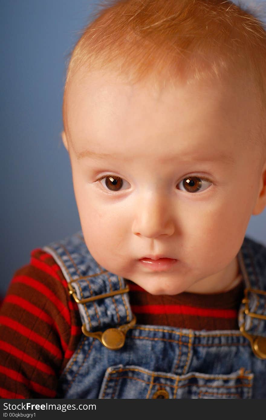 A little boy looking around him. A little boy looking around him