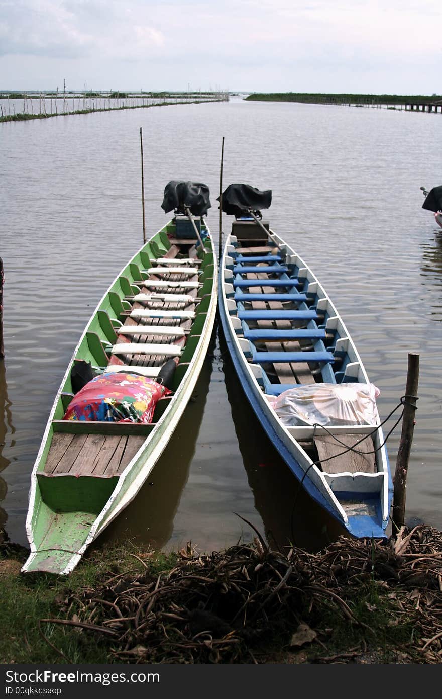 Boat ferrying tourists around the RAMSAR site near Thale Noi, Thailand. Boat ferrying tourists around the RAMSAR site near Thale Noi, Thailand.