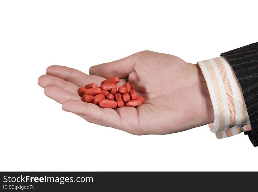 Hand with Vitamins. Isolated on white background.