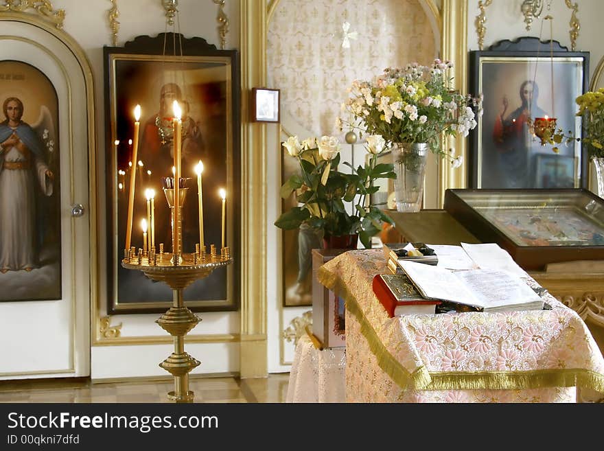 Church interior, altar, candles, bible