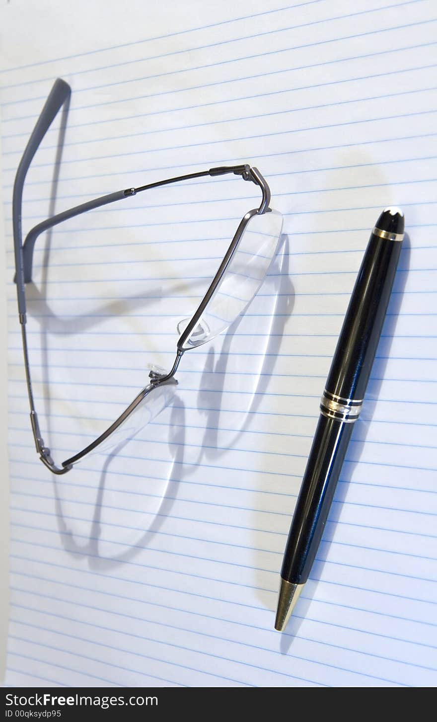 Pen Paper and Glasses