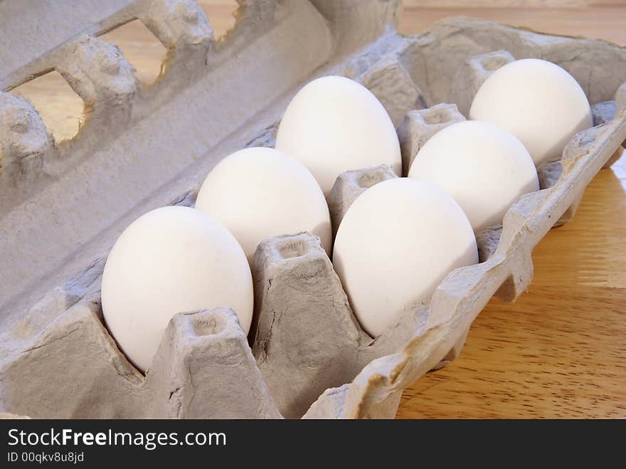 White eggs in cardboard carton