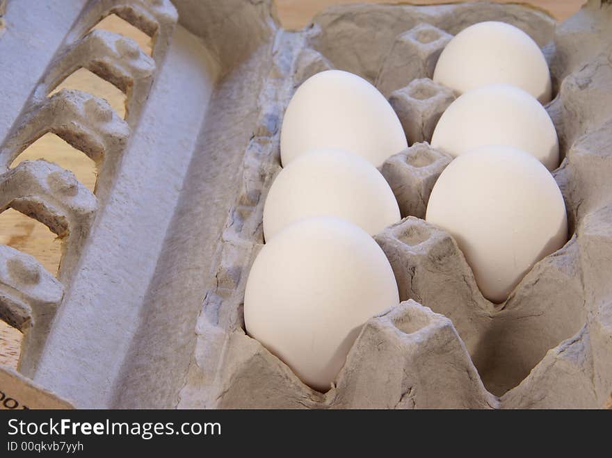 White eggs in cardboard carton