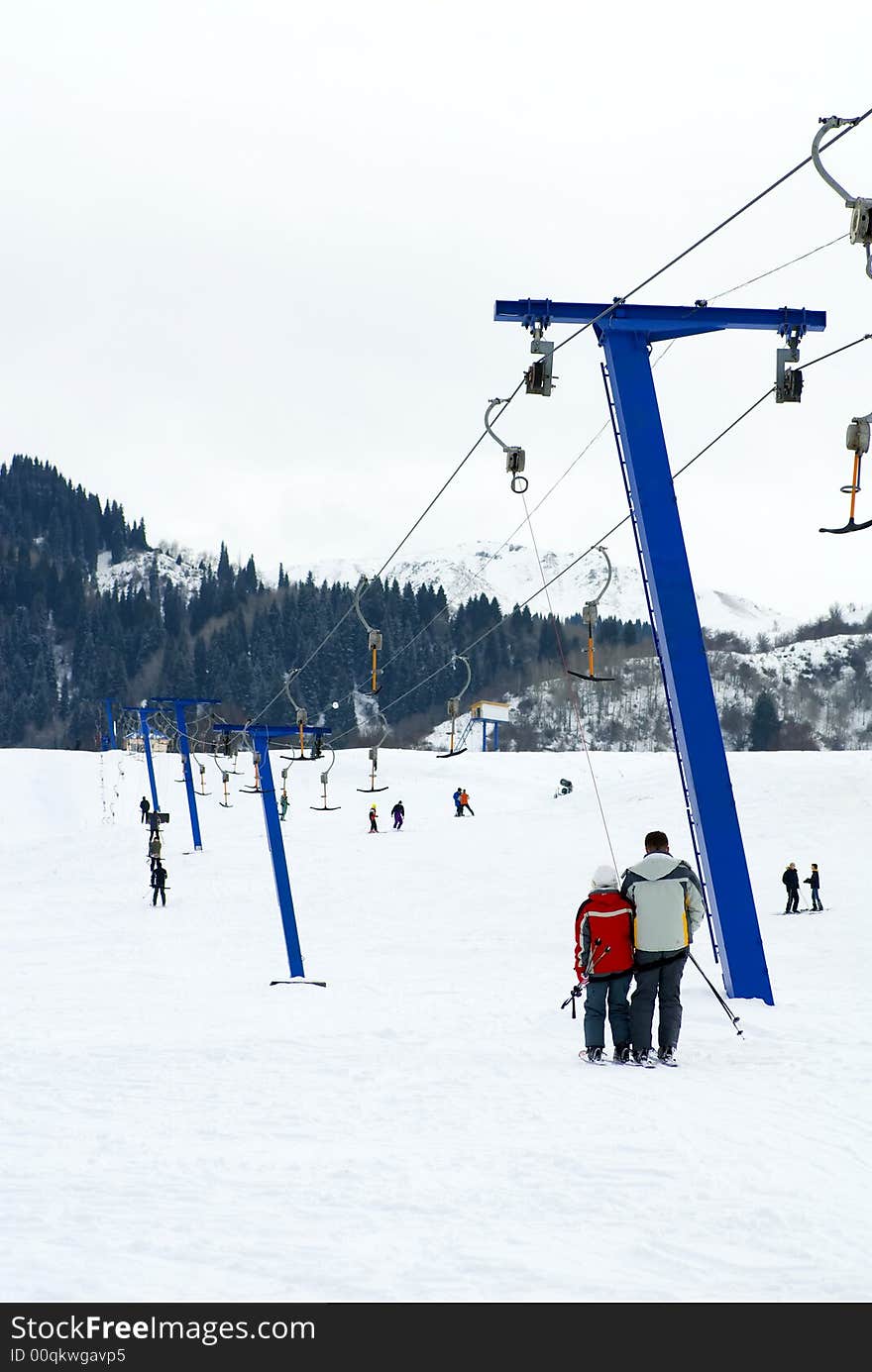 Skiers rise on the lift