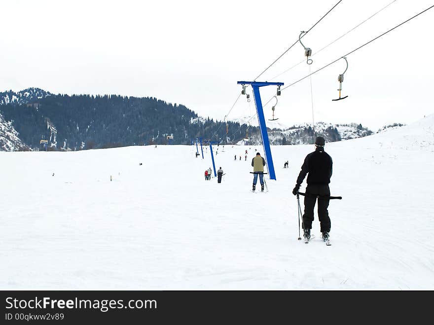 Skiers rise on the lift