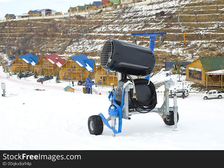 Snow gun on a slope of mountain