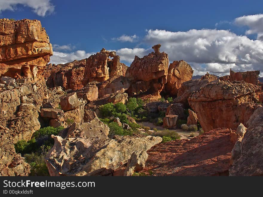 Red cliff and stone in desert