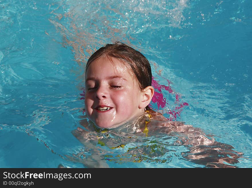 Girl having fun just floating in a pool. Girl having fun just floating in a pool