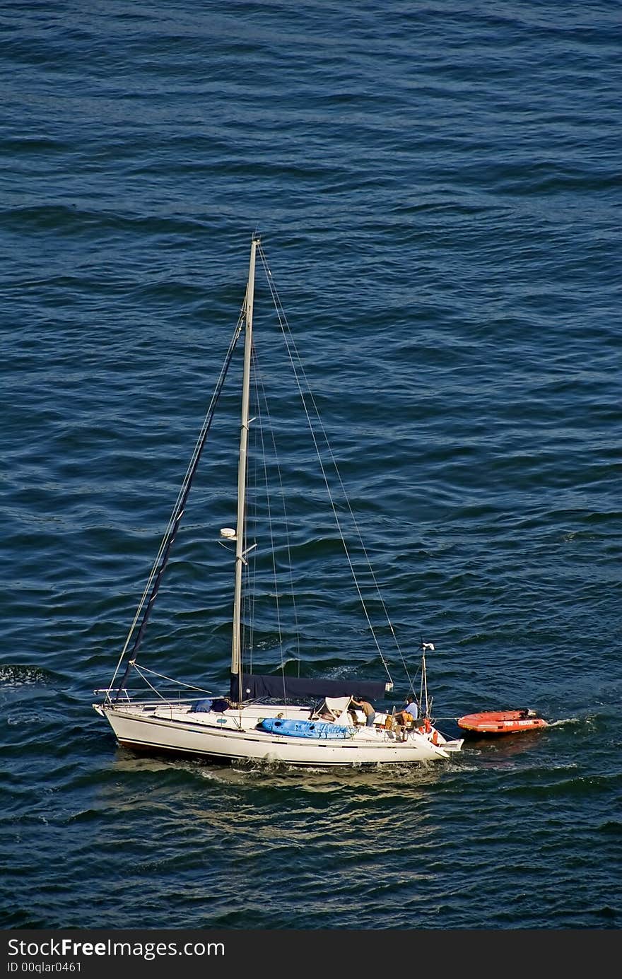 A lone Yacht leaving for next leg of trip around the world. A lone Yacht leaving for next leg of trip around the world