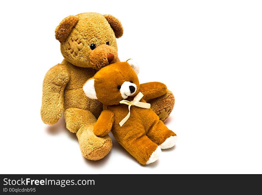 Two brown teddies having a loving cuddle. Two brown teddies having a loving cuddle