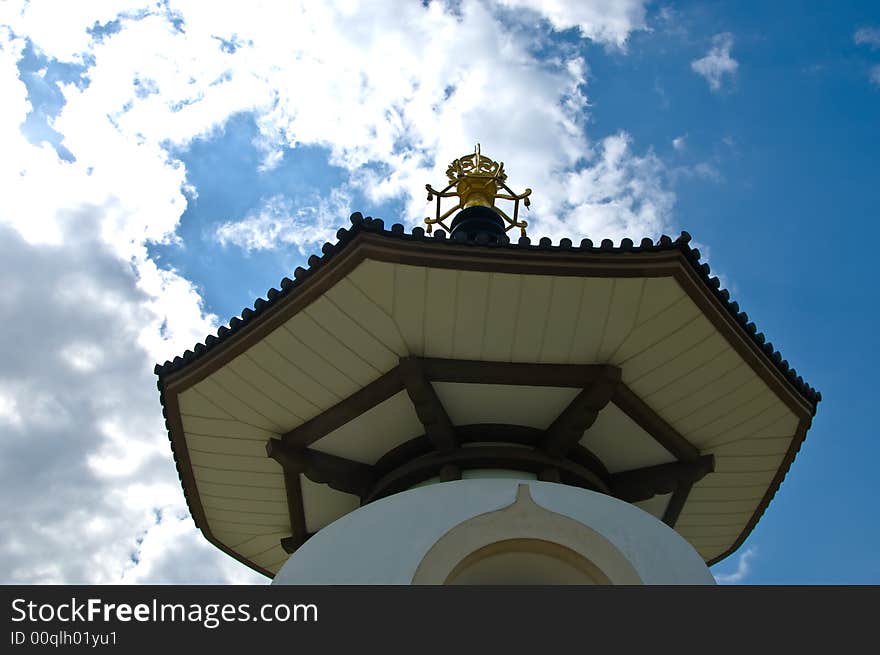 Buddhist peace pagoda against a blue sky