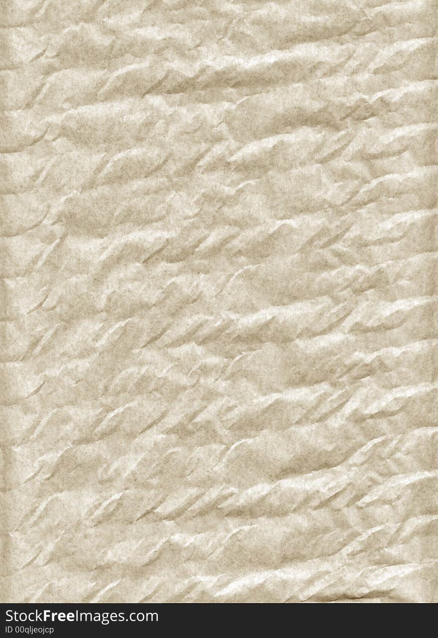 Crumpled paper. A porous paper. The thin structure fine chaotic fibers is visible