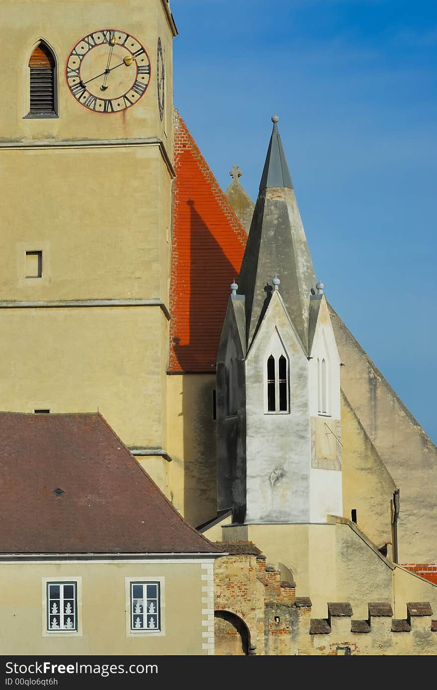 Historic church of Weissenkirchen with blue sky and clouds. Historic church of Weissenkirchen with blue sky and clouds