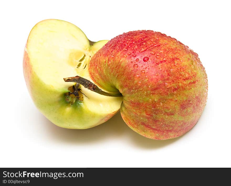 Two half one red apples covered by water drops. Isolation on white. Shallow DOF. Two half one red apples covered by water drops. Isolation on white. Shallow DOF.