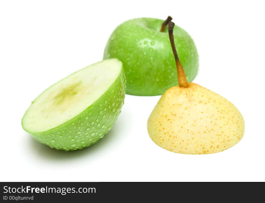 Slices of fruit on white. A pear and an apple. Isolation on white.