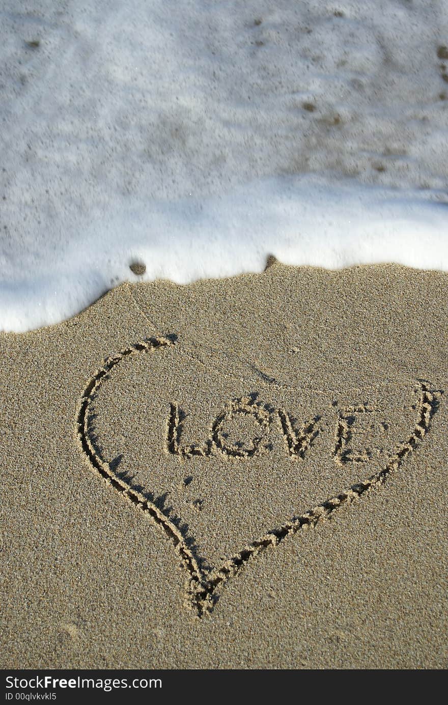 Heart drawn by hand in the wet sand. Heart drawn by hand in the wet sand