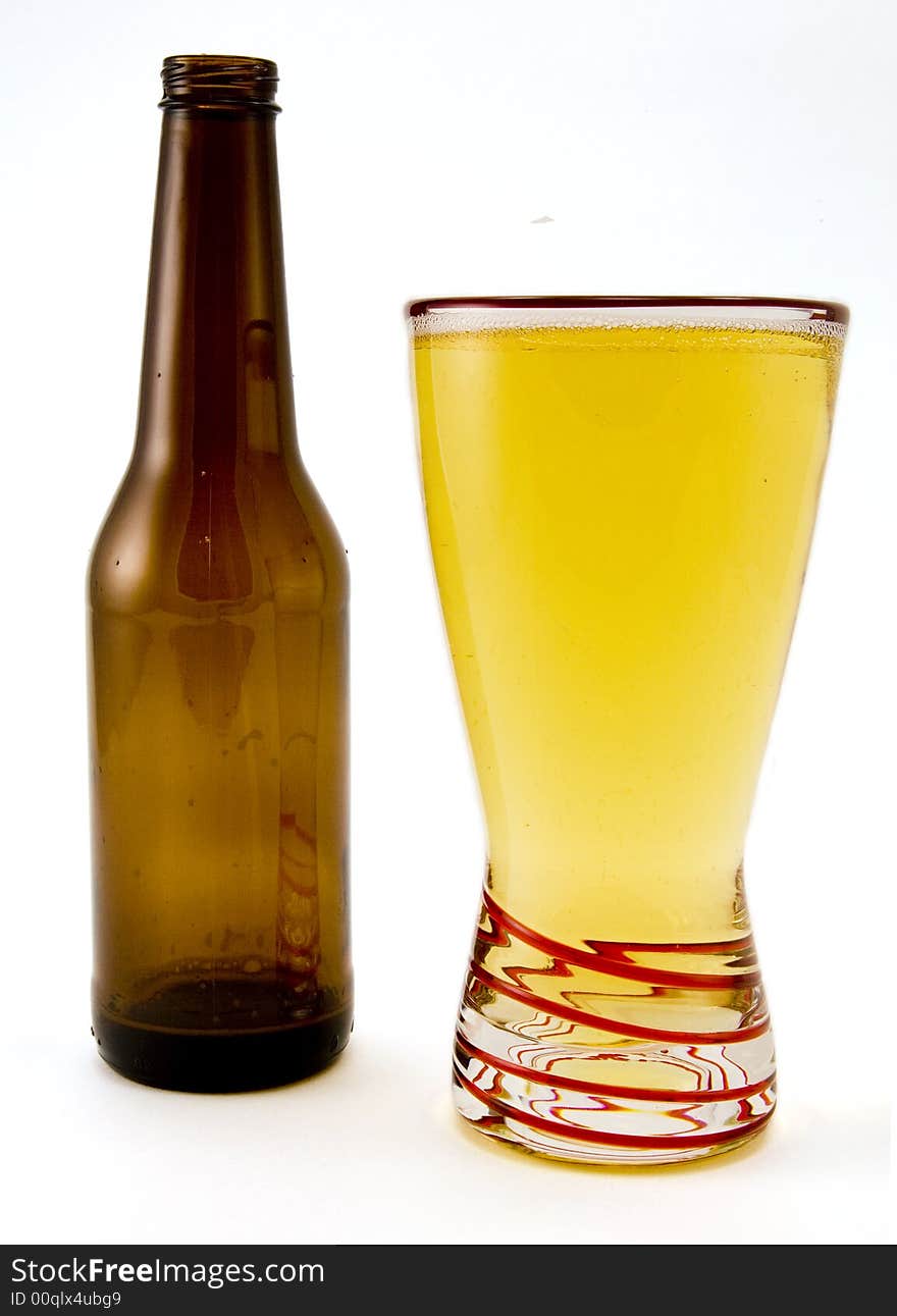 Full Glass of Beer and Beer Bottle Isolated on White Background. Full Glass of Beer and Beer Bottle Isolated on White Background.