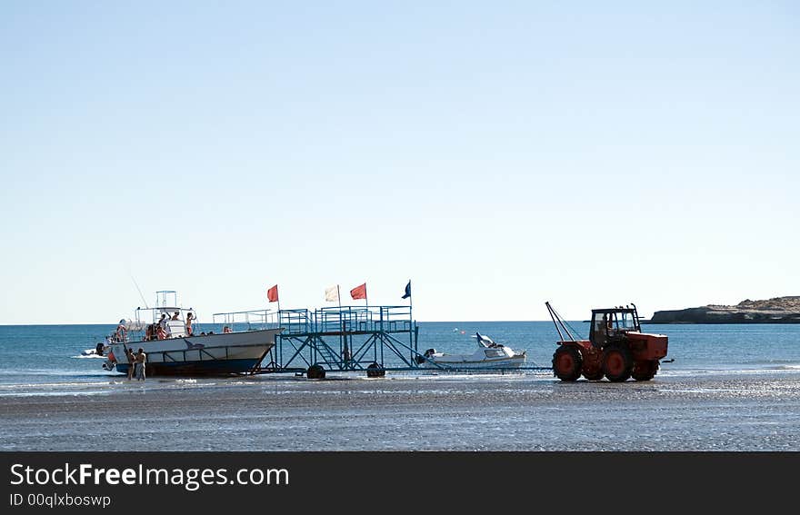 Boat Being Pulled Out Of The Water By A Tractor