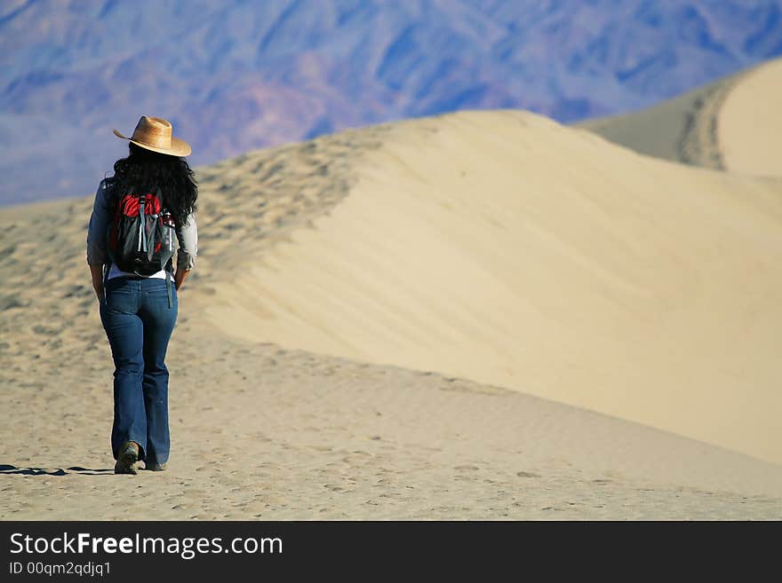 A girl hikes in the desert. A girl hikes in the desert