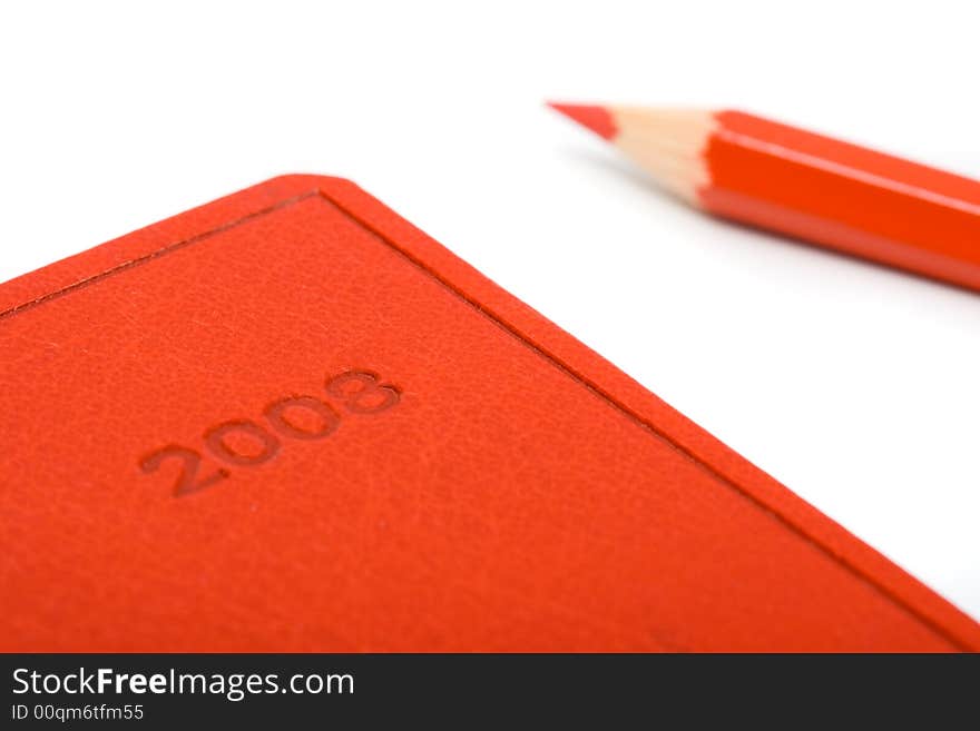 Red Notebook With Pencil