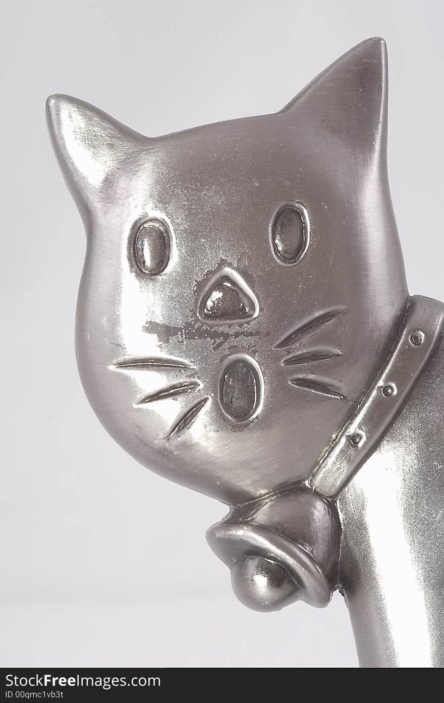 Head of a metal toy cat