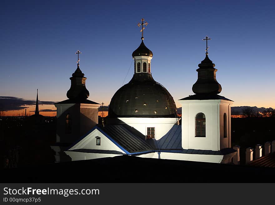 Orthodox temple with illumination on a background of a decline. Orthodox temple with illumination on a background of a decline