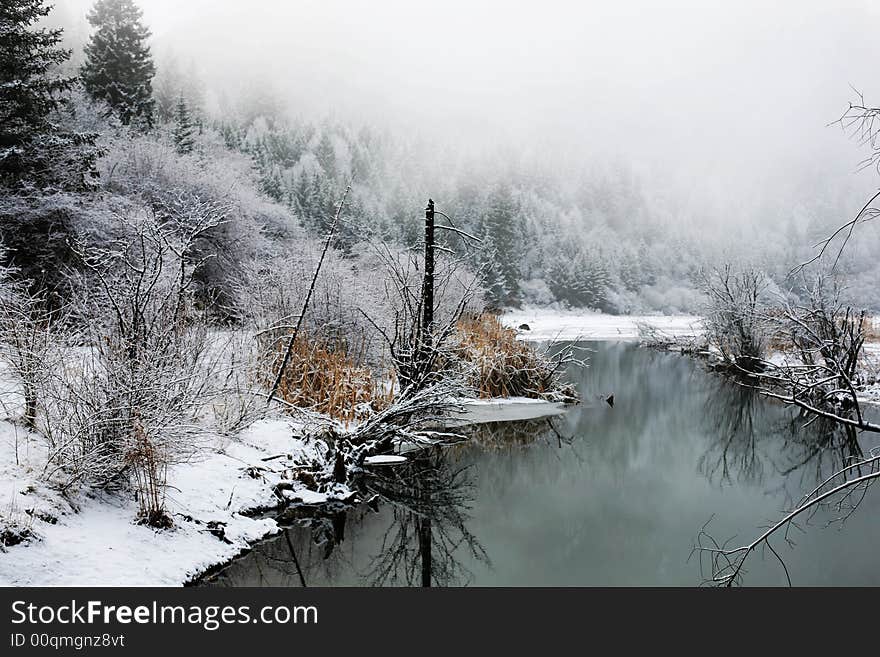 This was headstream of Min River in Jiuzhaigou, Sichuan Province, P.R.China. After snowing, the banks of the river, trees and the mountain were all changed into white.This was an argent world. This was headstream of Min River in Jiuzhaigou, Sichuan Province, P.R.China. After snowing, the banks of the river, trees and the mountain were all changed into white.This was an argent world.