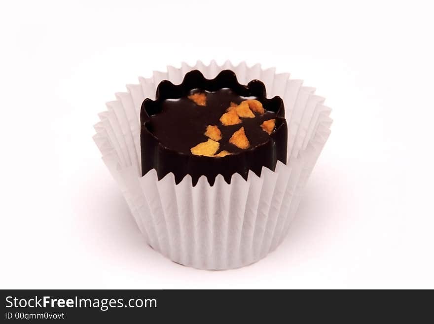 Delicious chocolate sweet on the white background. Delicious chocolate sweet on the white background