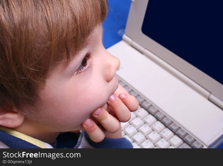 Young boy using a laptop