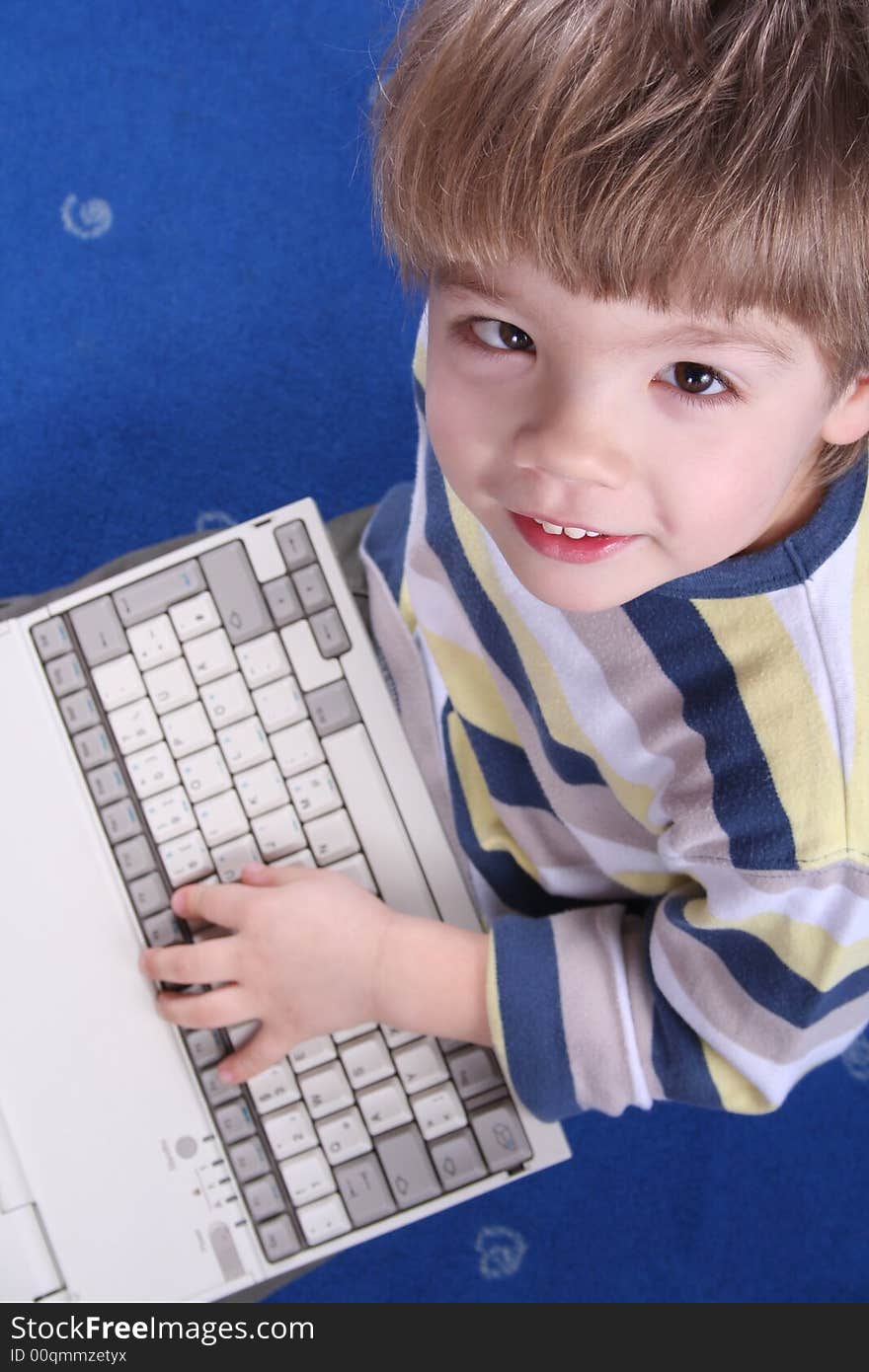 Young boy using a laptop