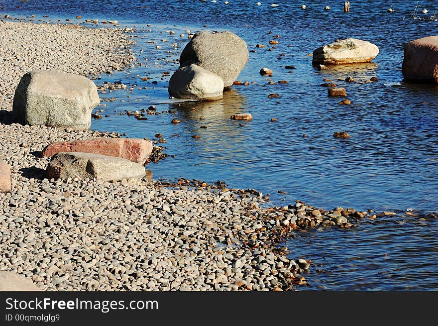 Stones on the winter lake shore