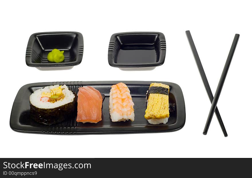 Assortment of sushi on a plate,  isolated on a white backgroud