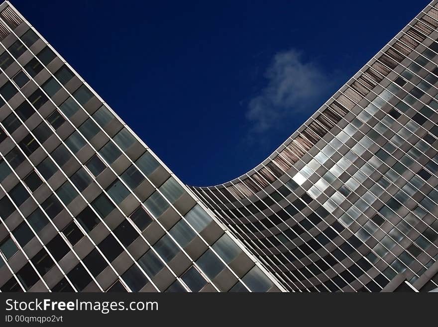 Modern skyscraper against the dark blue sky