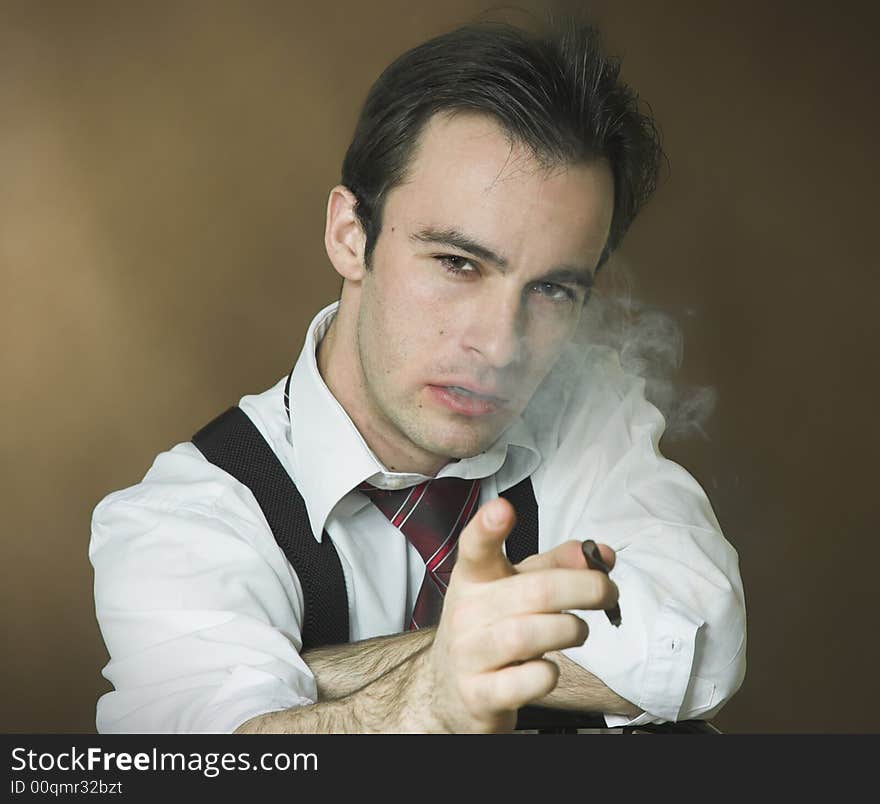 Smoking the man on a dark background. Smoking the man on a dark background