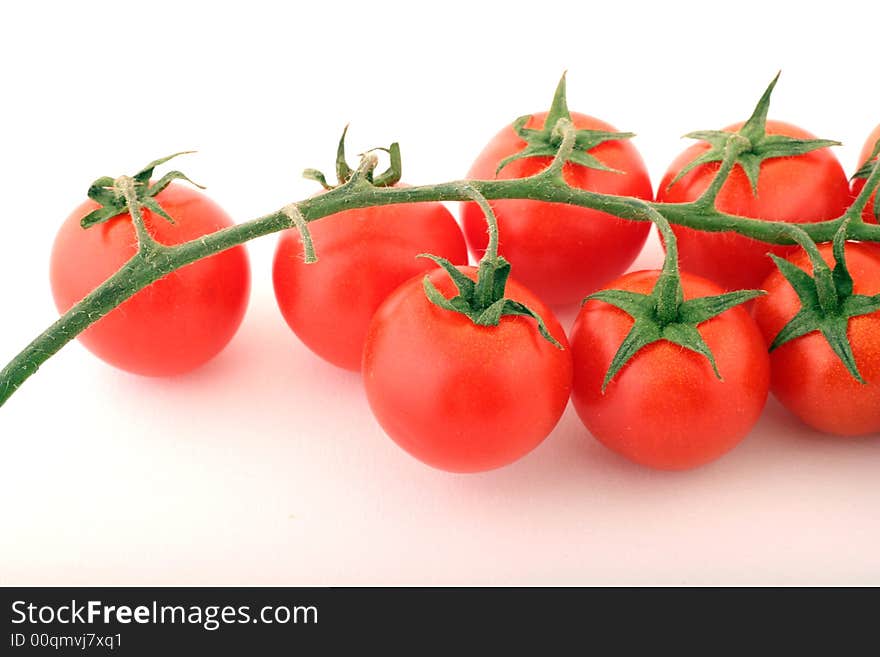 Cherry Tomatoes on a withe background.