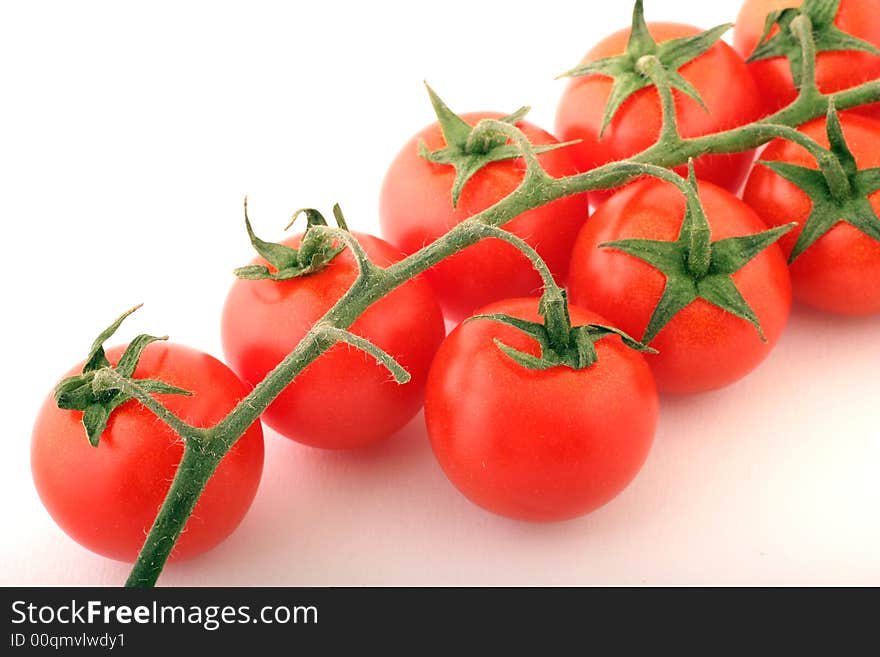 Cherry Tomatoes on a withe background.