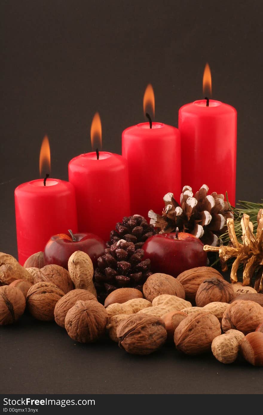 Advent red candels and still life on a black background.