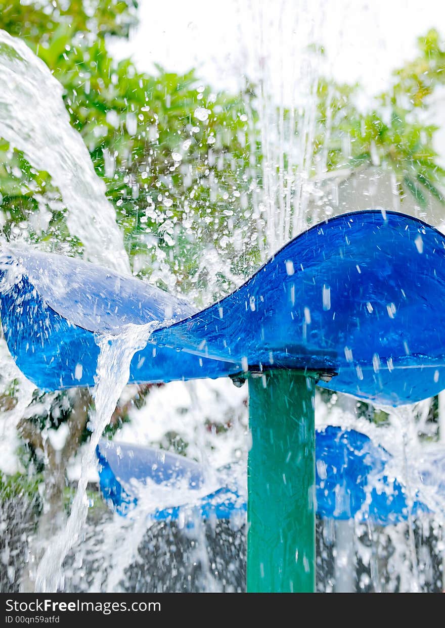 Fountain splashing and creating a wet misty environment in a children's water playground. Fountain splashing and creating a wet misty environment in a children's water playground