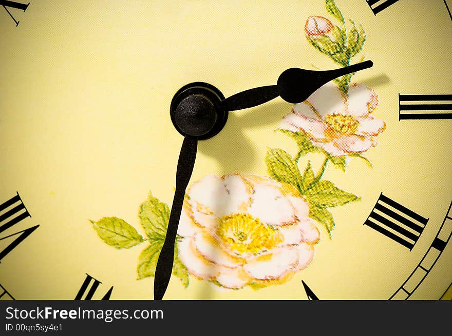 Antique clock-face with flowers